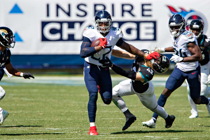 A stiff-arm from Henry—here in Week 2, plowing Jaguars safety Andrew Wingard—is a blast from the game's past.